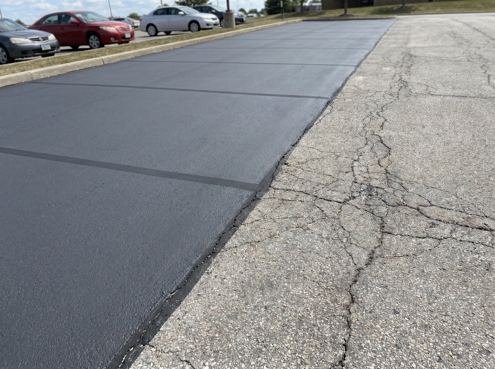 Freshly micro-sealed parking lot with a smooth restored finish